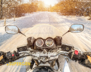 What maintenance checks are essential before a long winter motorcycle ride?